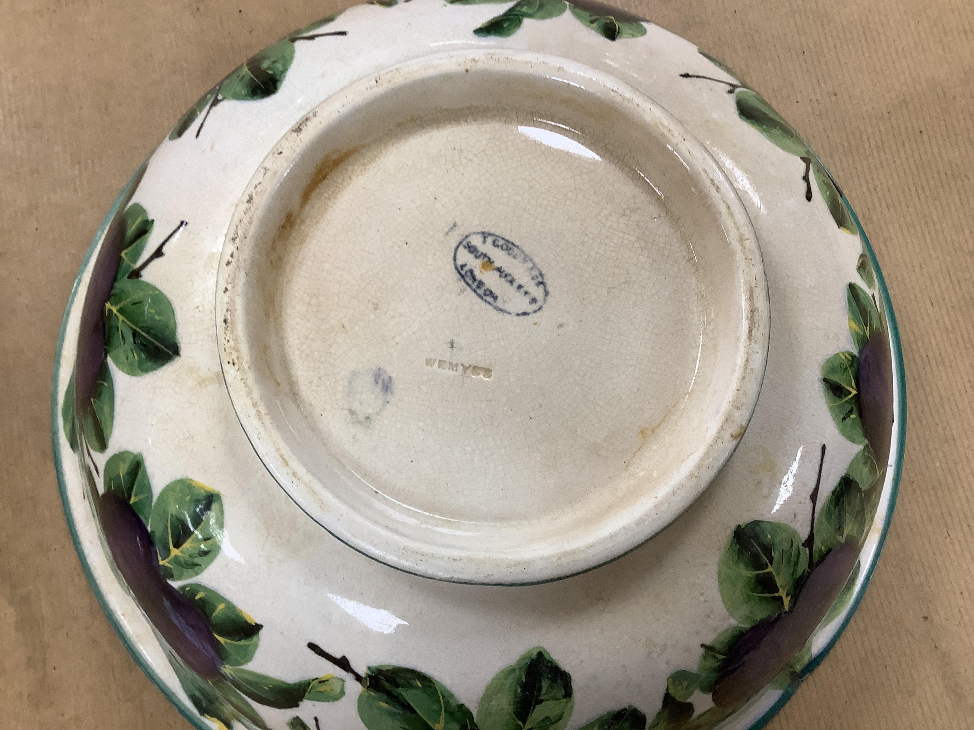 A Wemyss four-piece toilet set, a jug and basin, soap dish with liner, and bowl, damson pattern. Basin 39cm diameter., Condition - poor